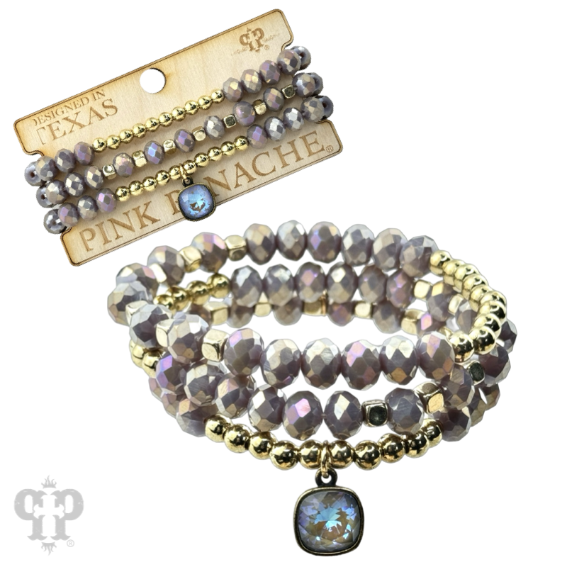 Faceted bead three strand bracelet with a crystal from Swarovski®